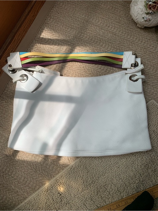 Sabrina Scala Handbags - Sabrina Scala white shoulder bag with a rainbow strap.